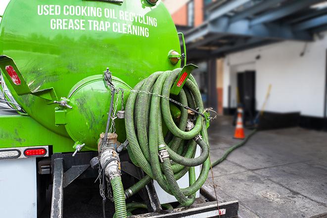 a service truck pumping grease from a restaurant's grease trap in Doylestown